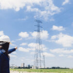 lady safety helmet pointing high voltage line lady safety helmet pointing high voltage line